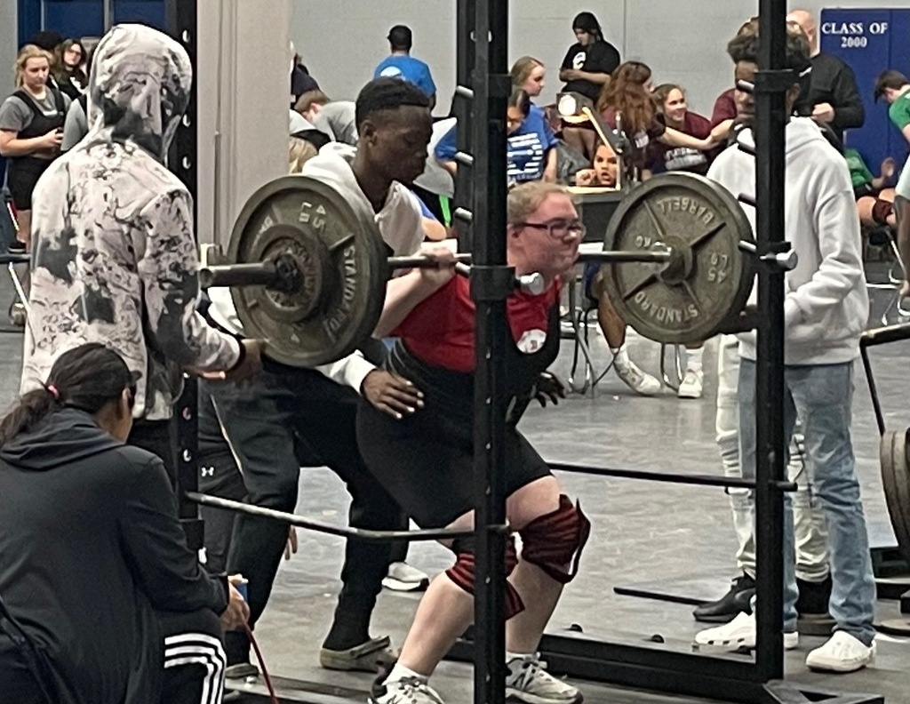 Vivian doing weighted squat at Powerlift Meet